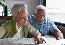 african american man and woman looking at document
