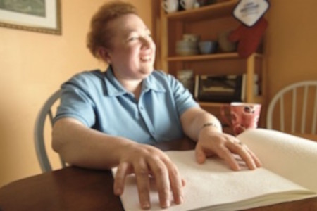 Woman reading Braille 
