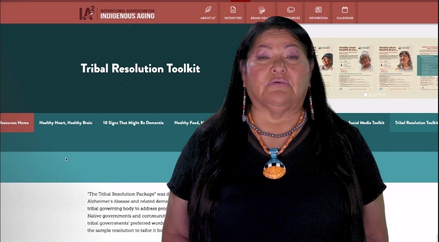 Molita Yazzie with screenshot from IA2's dementia-specific Tribal Resolution Toolkit webpage