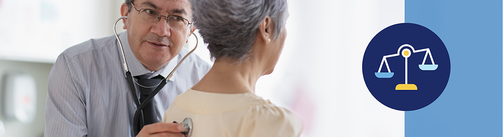 Mature male doctor listening to the back of a senior woman with a stethoscope