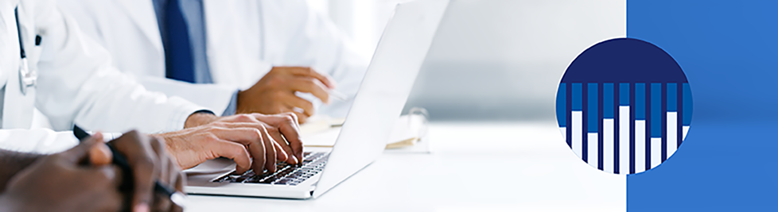 medical personnel typing into computers with an icon of a graph to the right