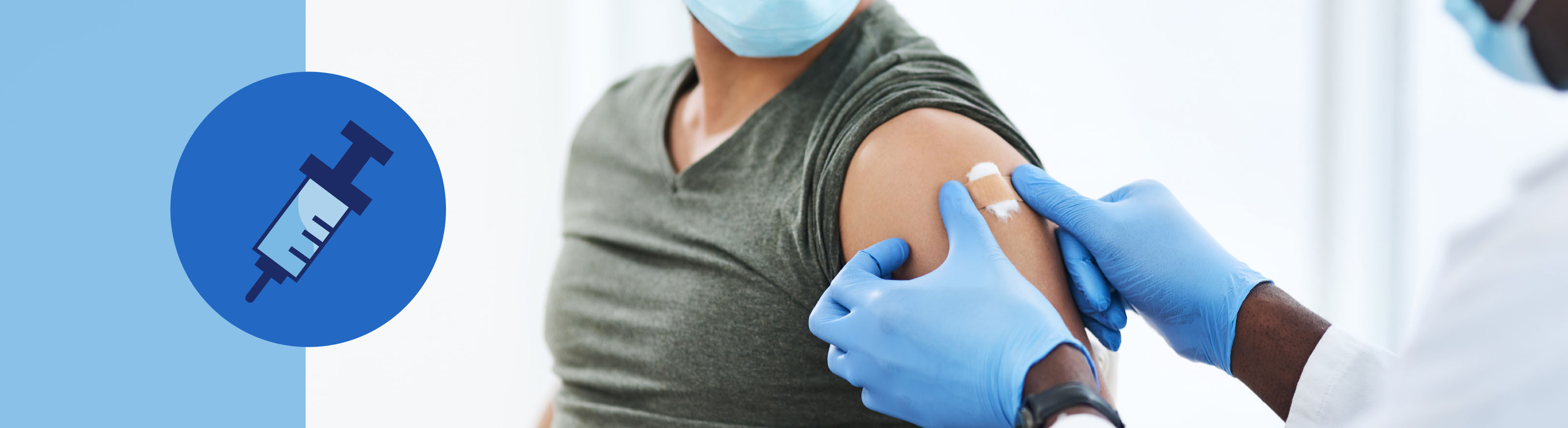 Photo of doctor placing bandage on patient's arm 